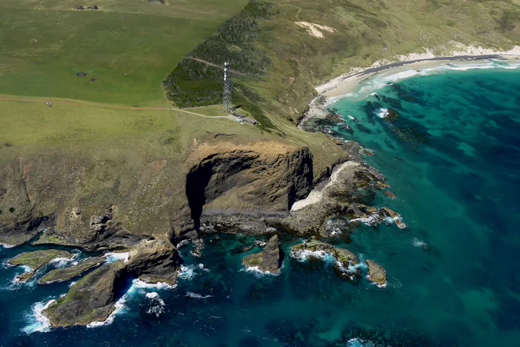 Aerial image of the air monitoring station at Kennaook/Cape Grim in Tasmania, view from the ocean looking towards the cliffs