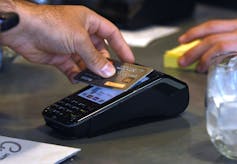 Man pays using a bank card