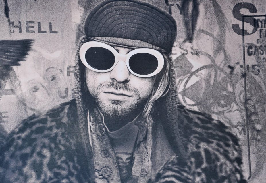Kurt Cobain in his now-iconic white sunglasses. 