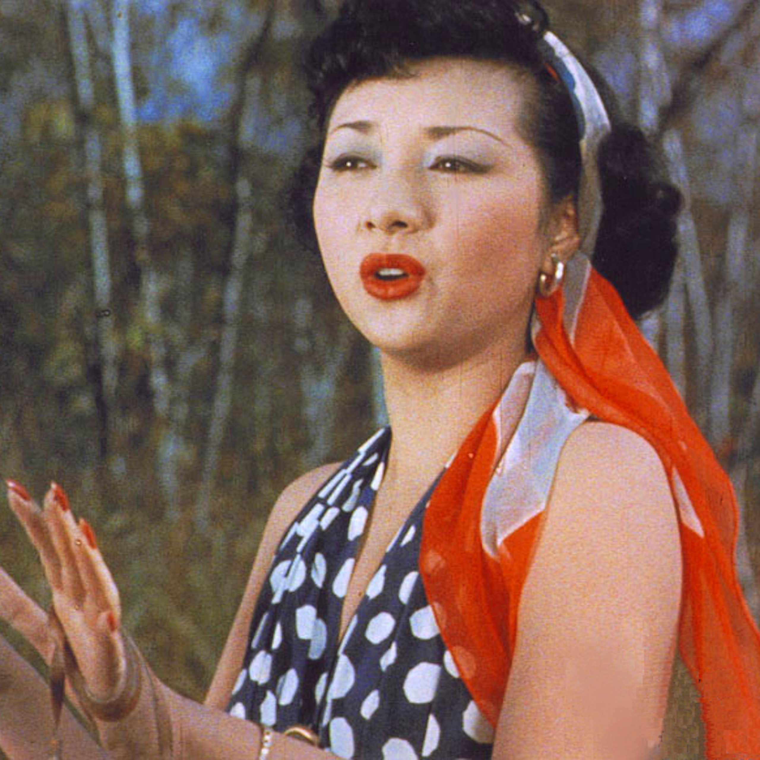 Hideko Takamine as Carmen with bright red lipstick and a scarf in her hair
