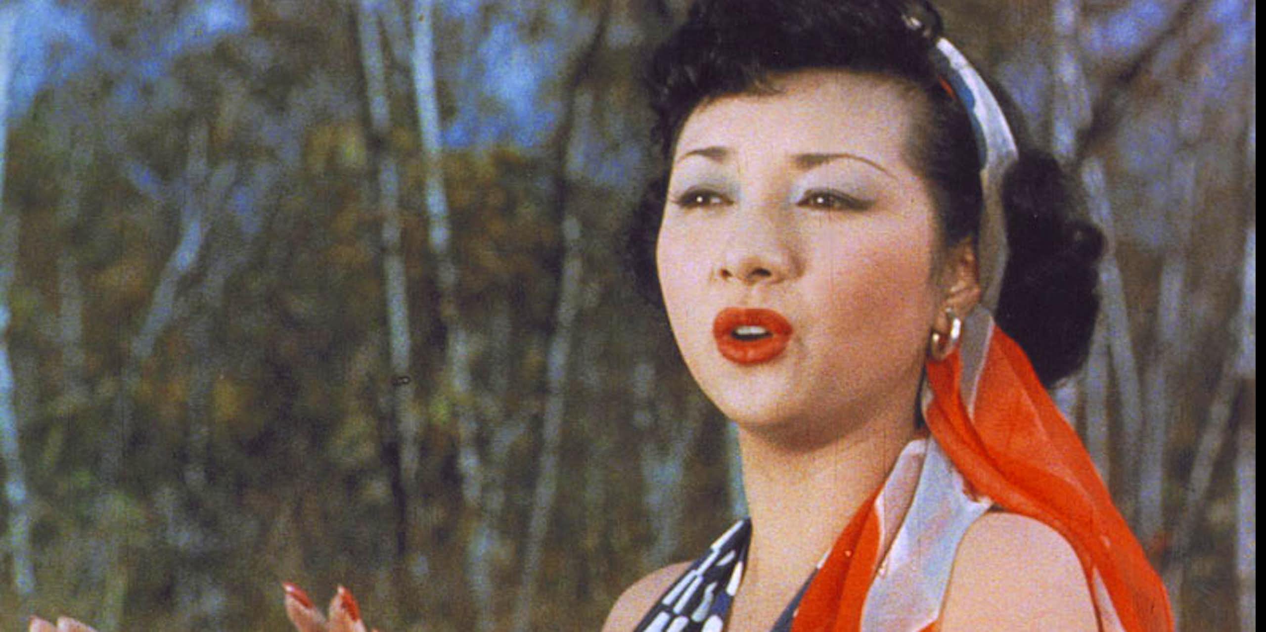 Hideko Takamine as Carmen with bright red lipstick and a scarf in her hair