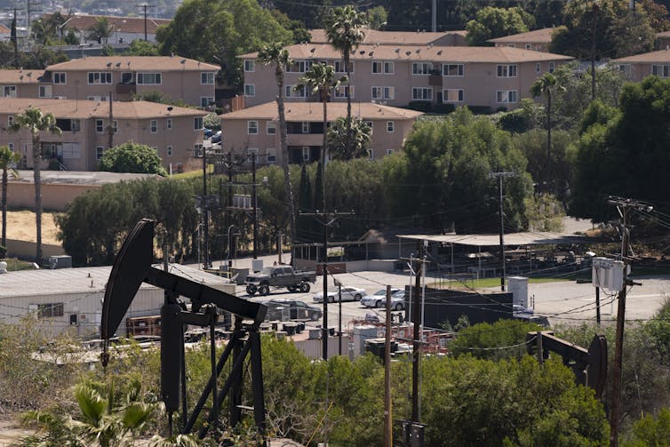 An oil pump across the street from apartment buildings in Los Angeles.