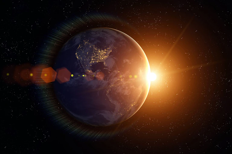 Image showing Earth floating in space with the Sun in the background.