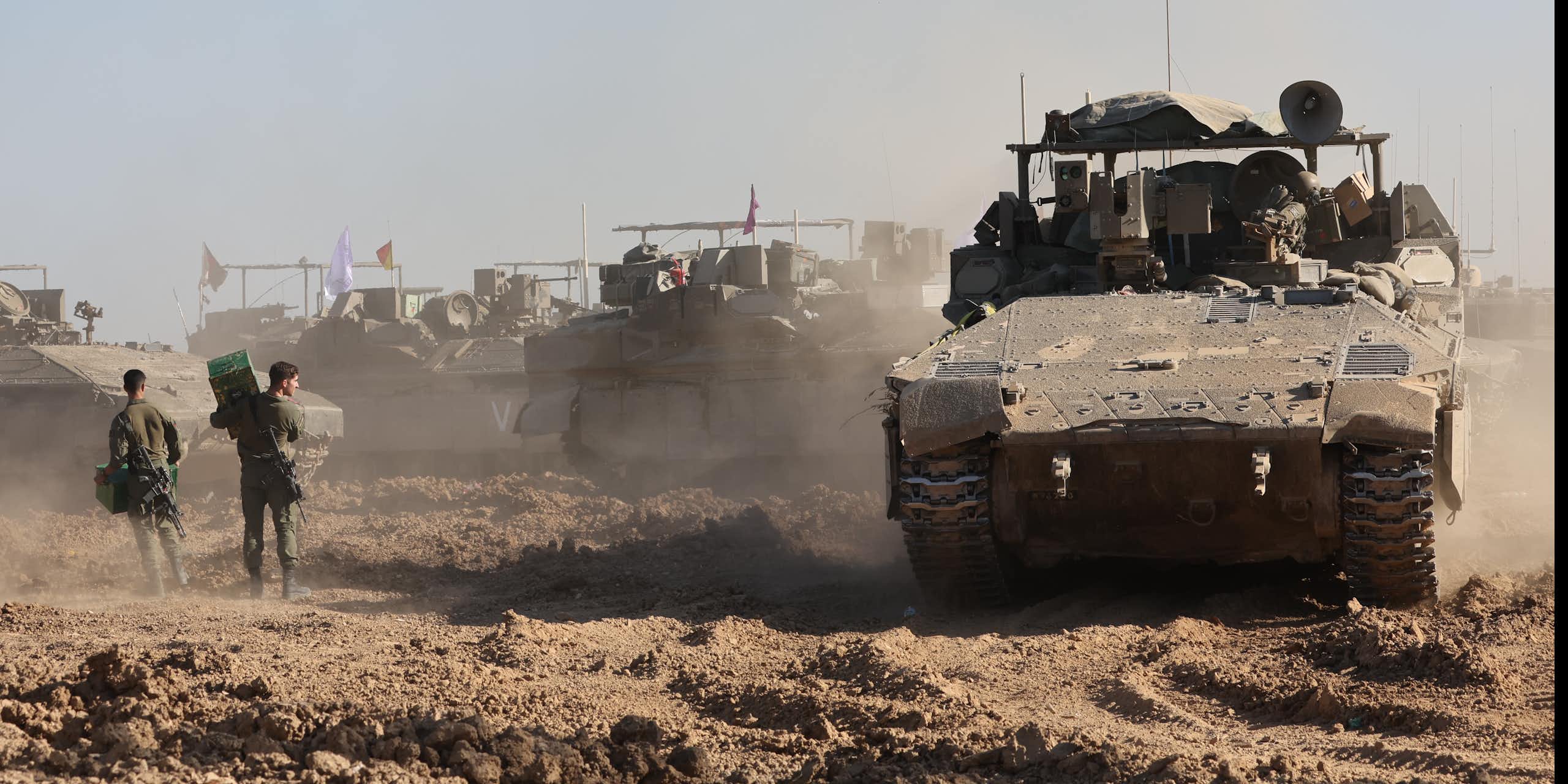 Israeli troops and tanks assemble outside the Gaza Strip, March 2024.
