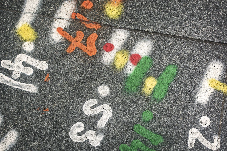 Engineering marks on a road surface.