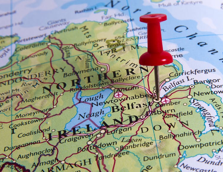 A map with a red pin in it.