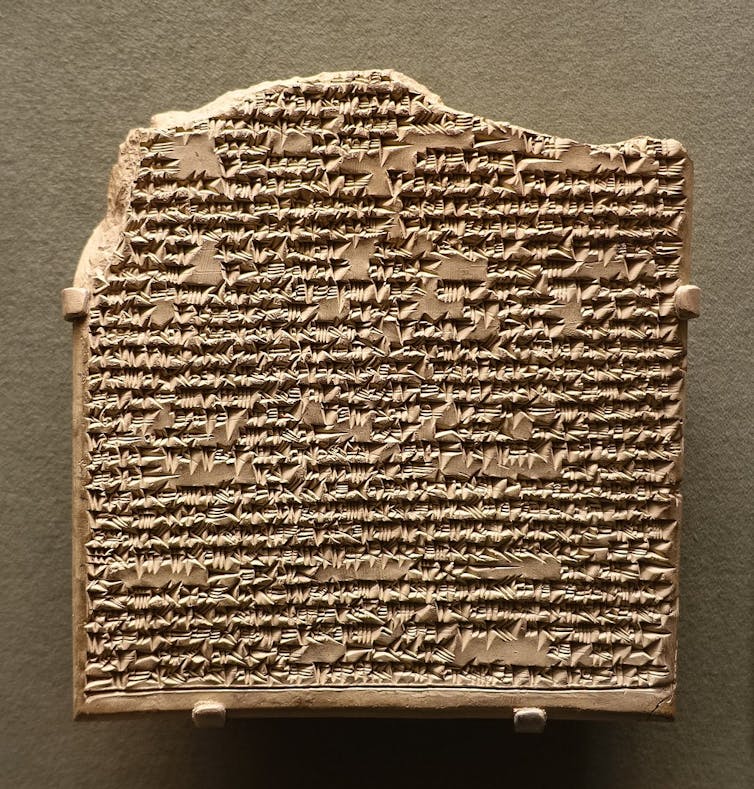 a clay tablet with writing