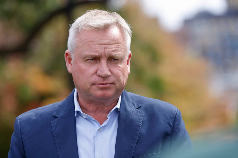 A man frowns, looking concerned