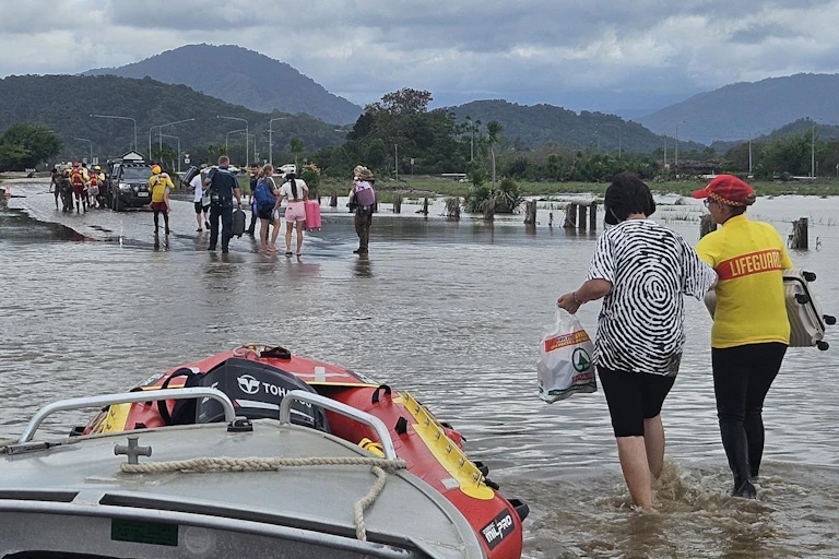 Australian Army soldiers from 51st Battalion, Far North Queensland Regiment, assisting personnel from the Queensland Police Swift Water Rescue team and Surf Life Saving Queensland with recovery operations in Cairns' Northern Beaches on Monday, December 18, 2023.