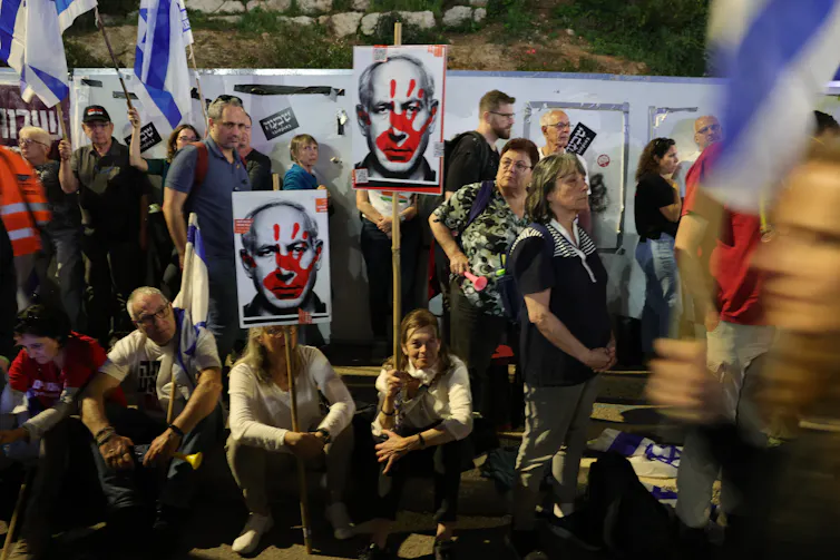 Protesters in Tel Aviv marching against Netanyahu's government.