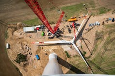 Assembled rotor blades of a wind turbine are seen from high above