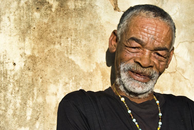 An older man with a grey beard.