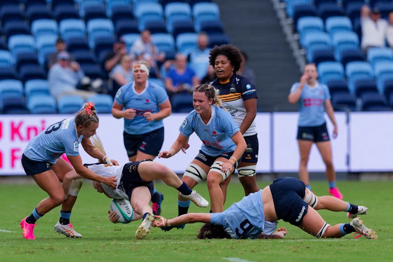 Women playing rugby