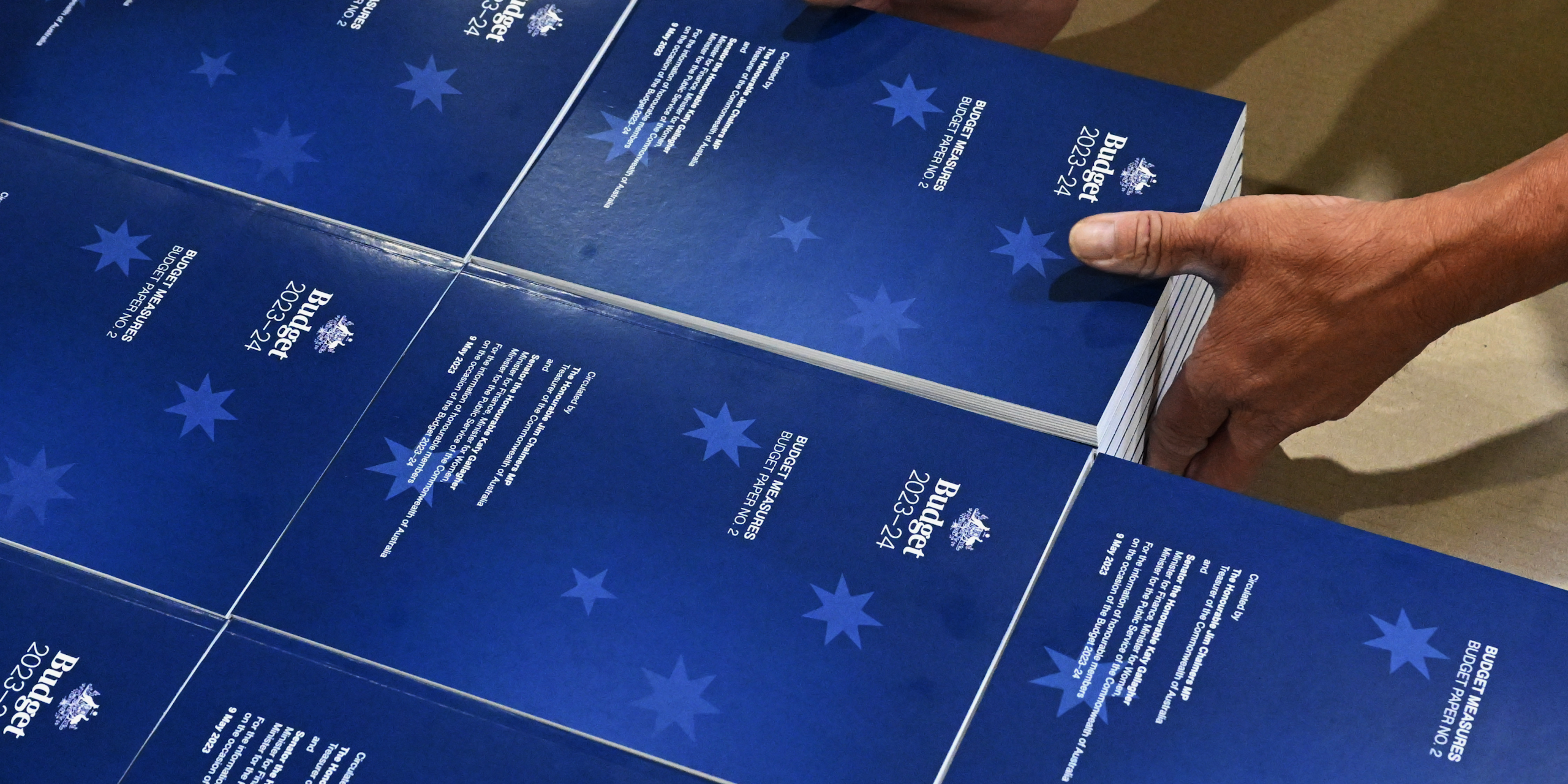 Photo of 2023-2024 Budget Papers at a printing facility prior to being delivered to Parliament House