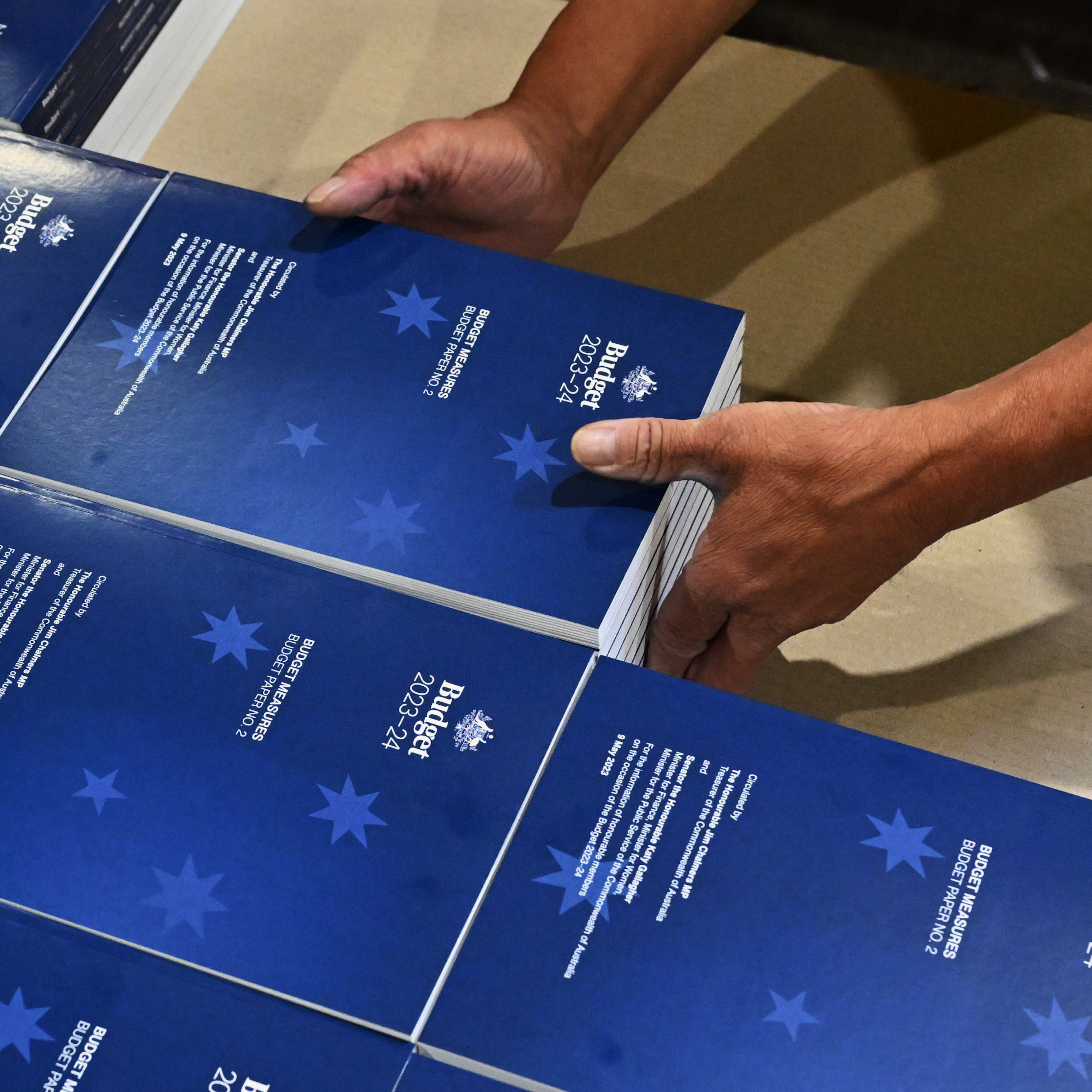 Photo of 2023-2024 Budget Papers at a printing facility prior to being delivered to Parliament House