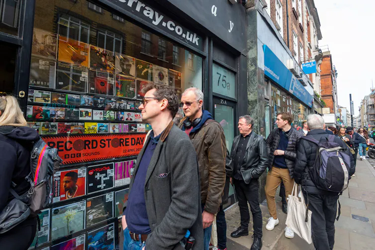 People queuing up outside an independent record shop