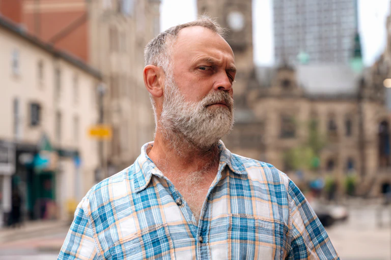 A man looking suspiciously at the camera.