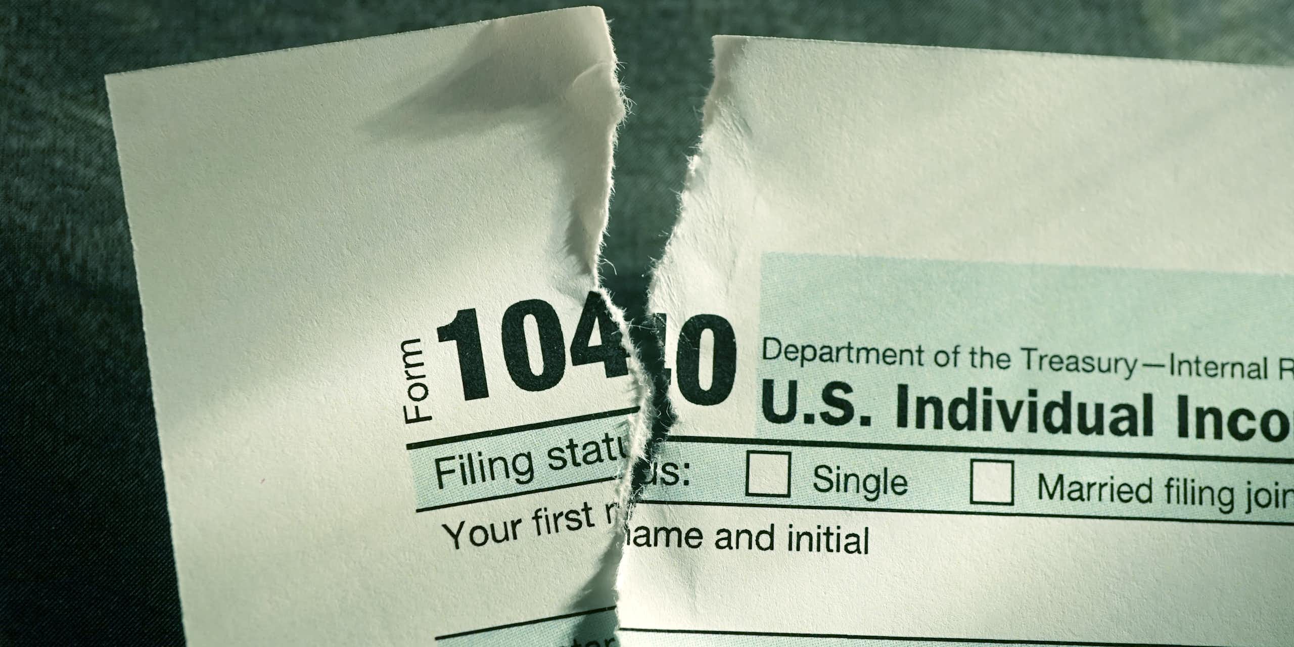 A torn-up copy of IRS tax form 1040.
