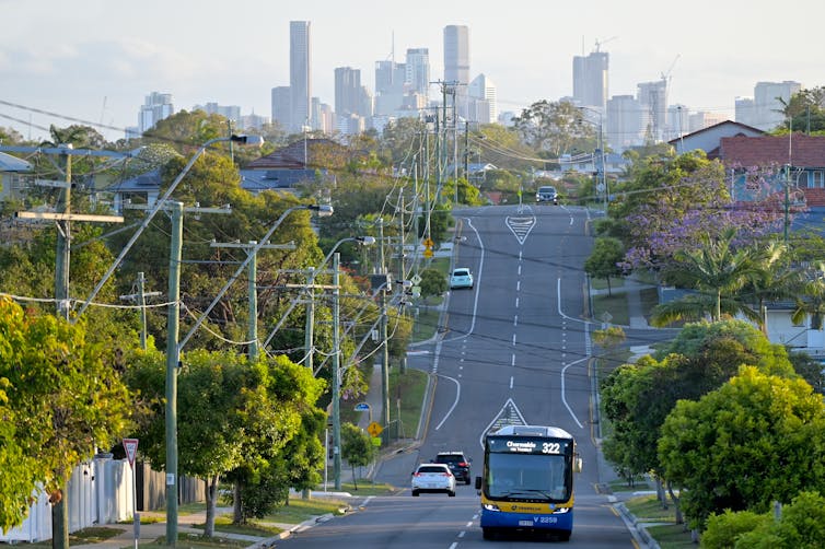 View along leafy street towards Brisbane CBD