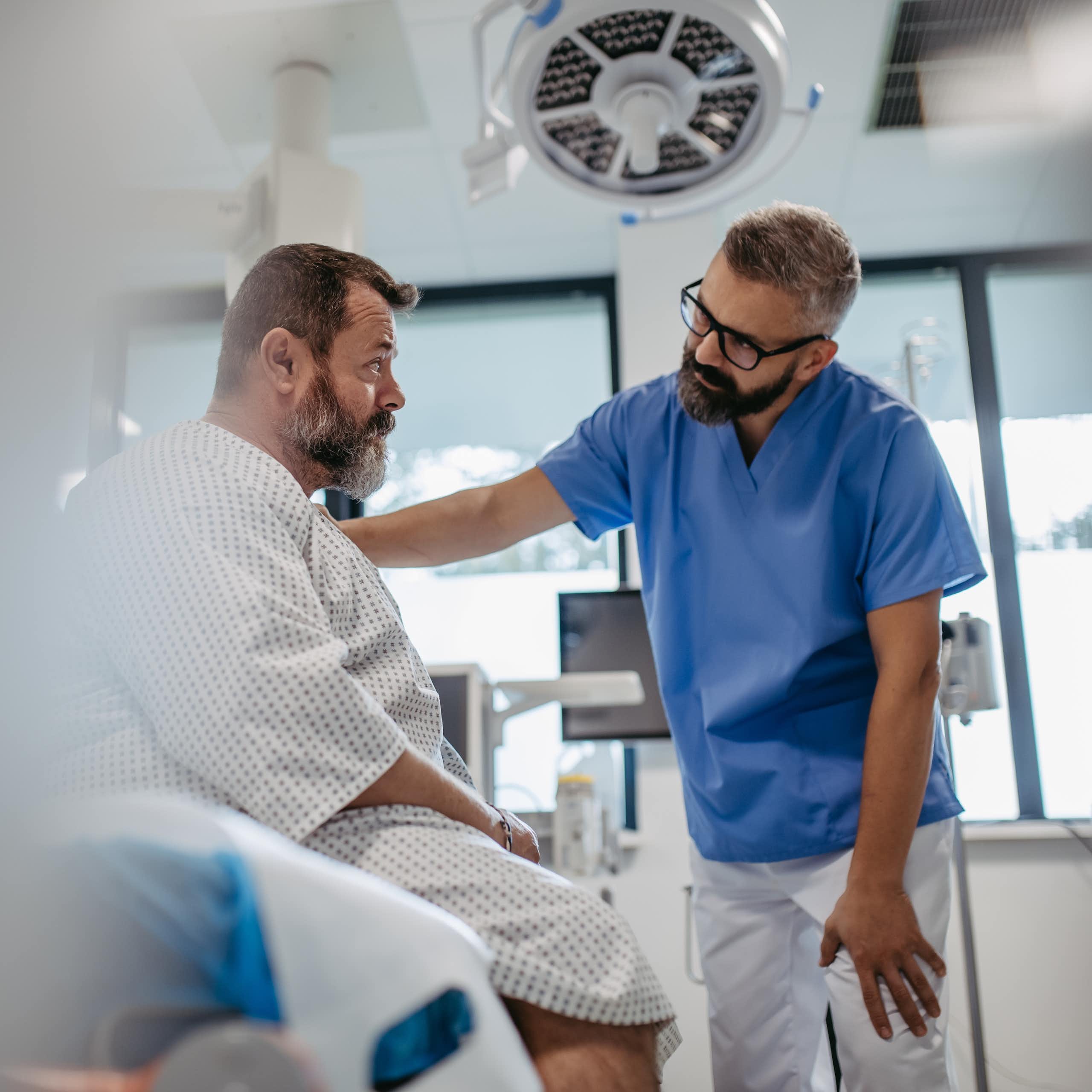 Clinician talks to patient