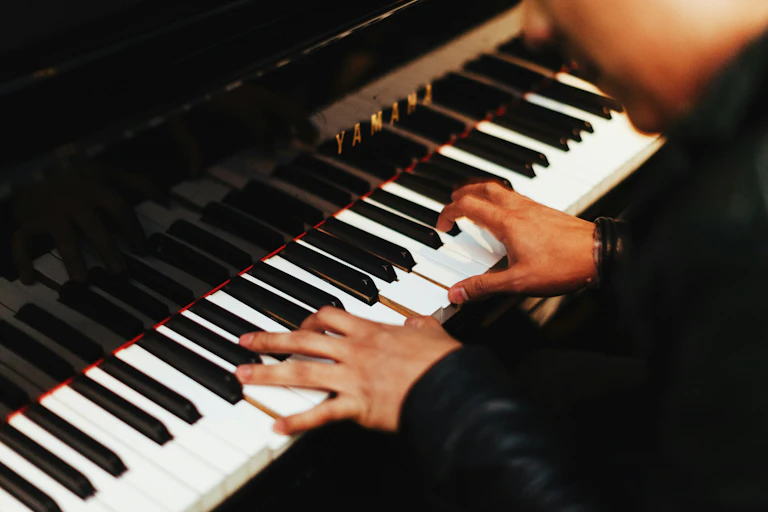 closeup hands playing piano