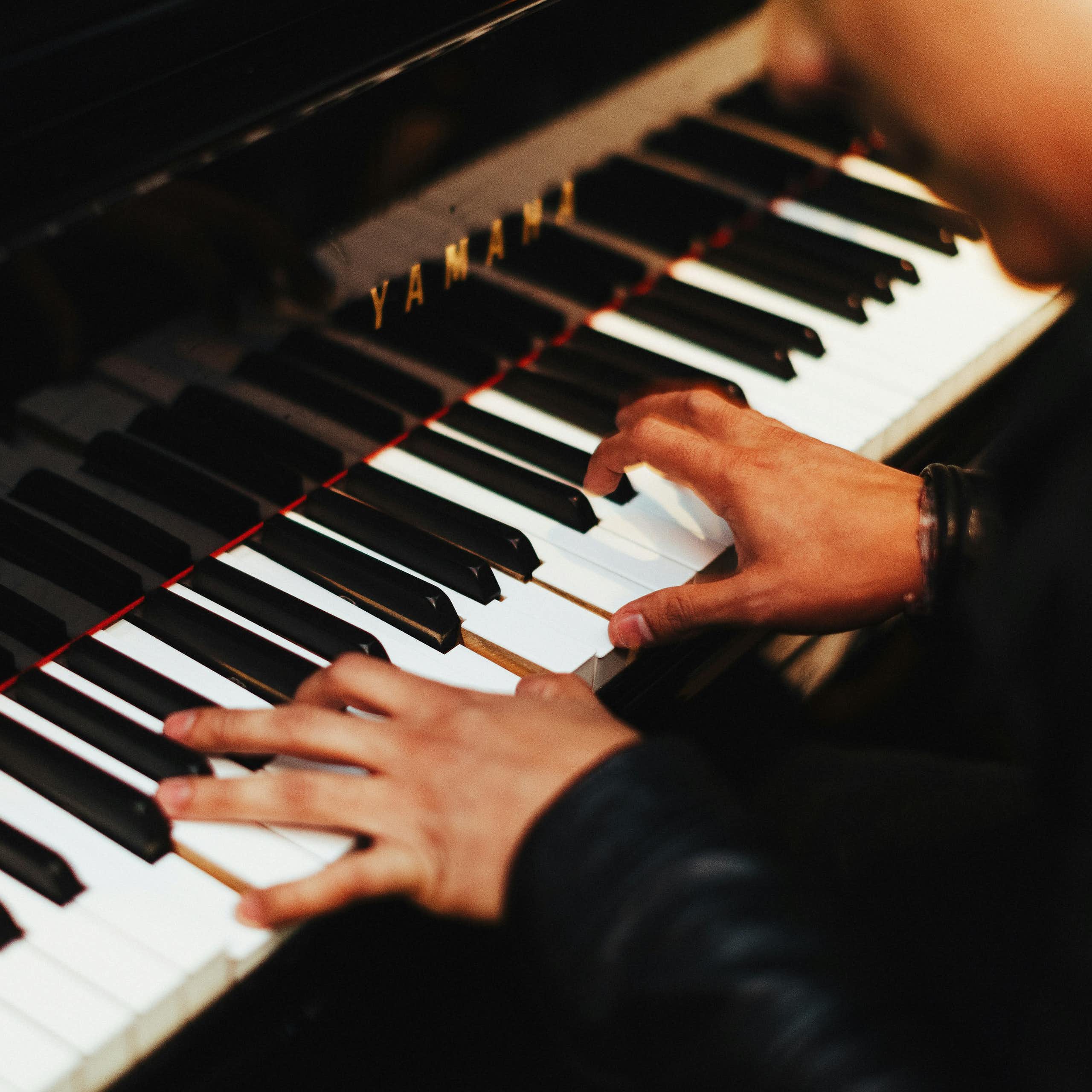 closeup hands playing piano