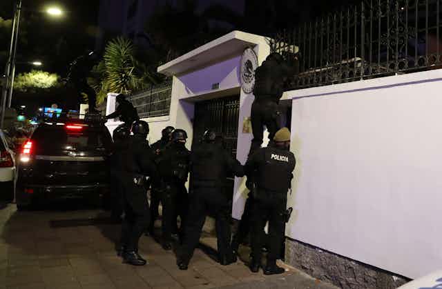 Ecuadorian security forces breaking into the Mexican embassy in the capital, Quito, on April 5 2024.