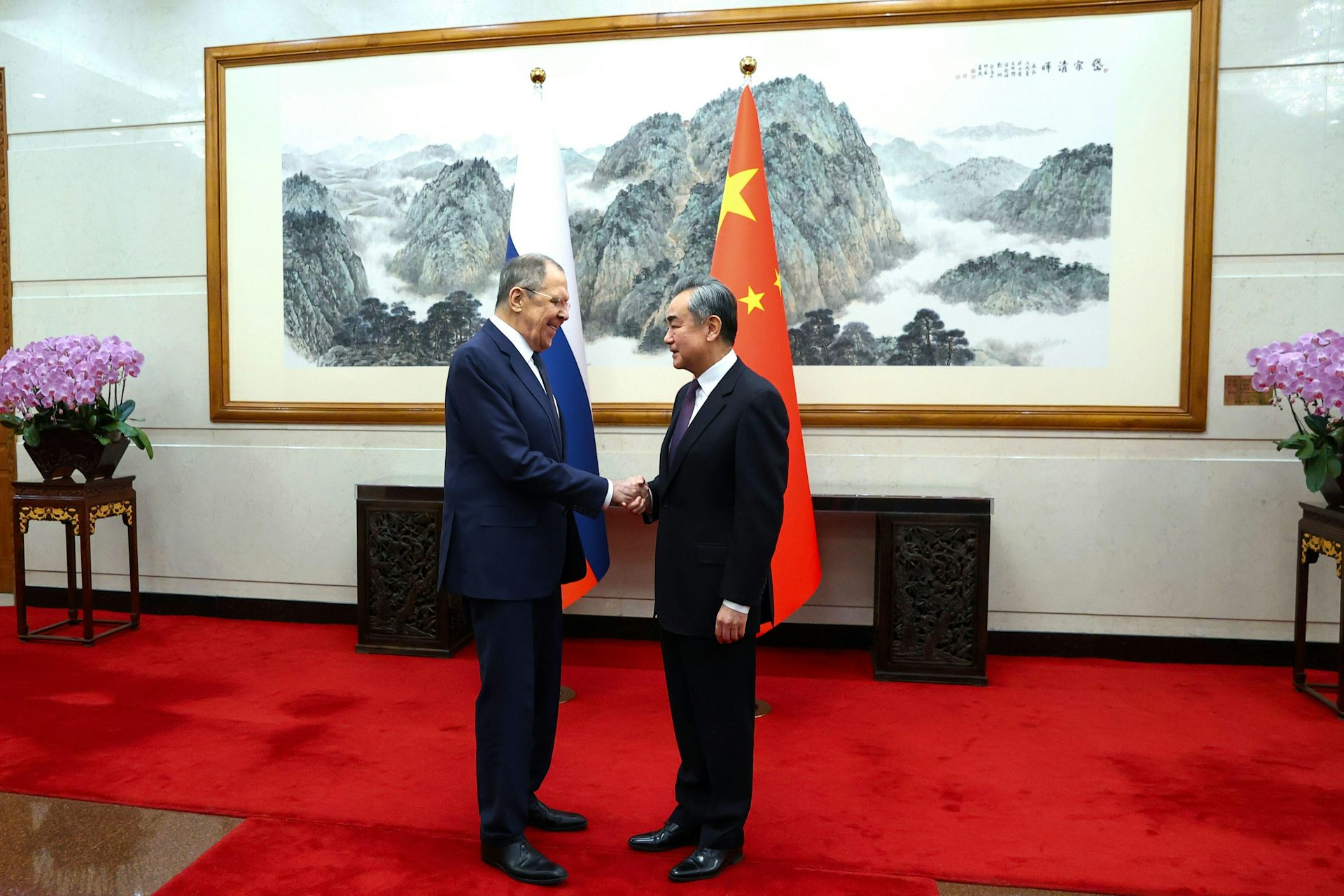 Lavrov and Yi shake hands in Beijing to discuss the ongoing relationship between Russia and China.
