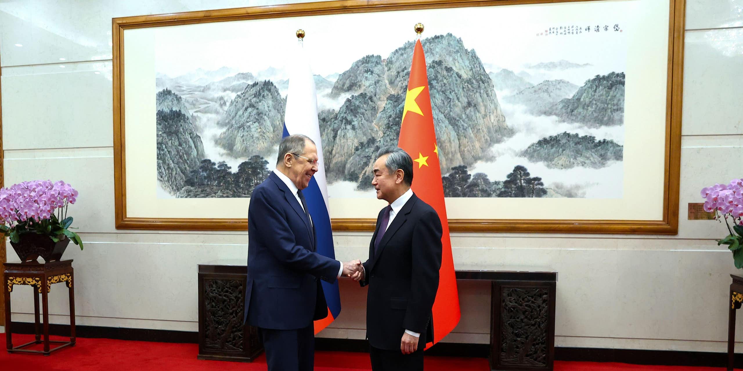 Lavrov and Yi shake hands in Beijing to discuss the ongoing relationship between Russia and China.
