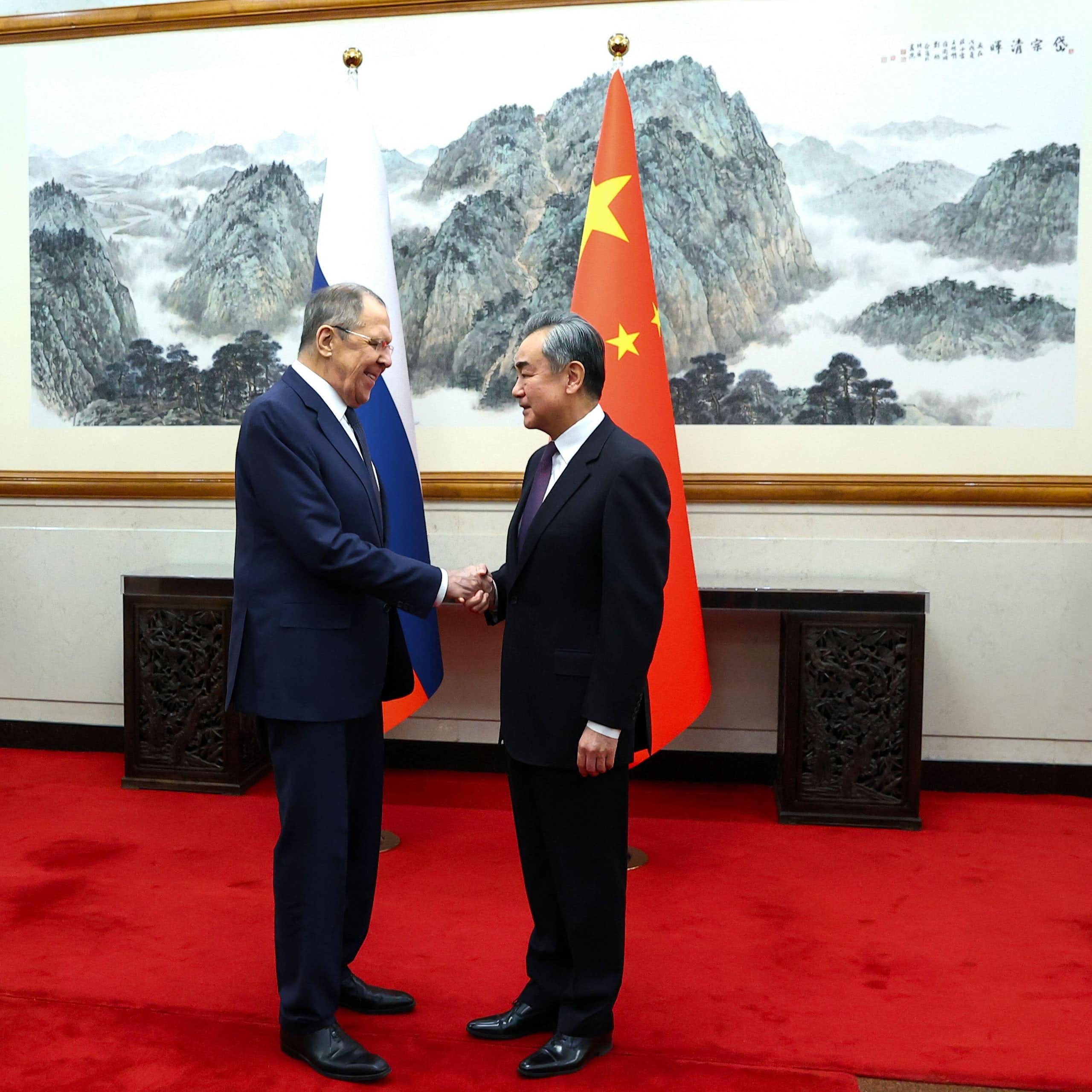 Lavrov and Yi shake hands in Beijing to discuss the ongoing relationship between Russia and China.