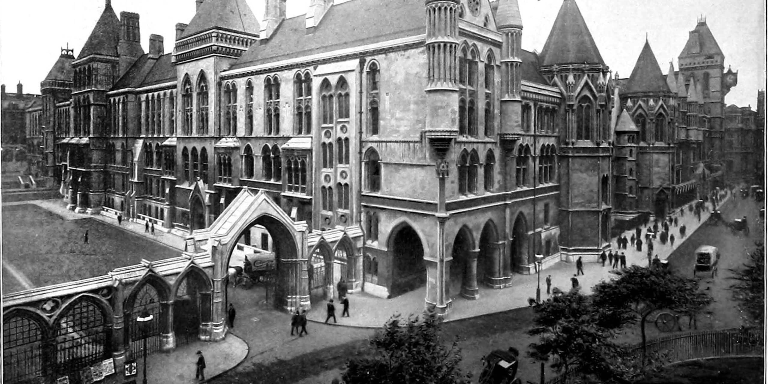 An archival photograph in black and white of a Victorian building complex.