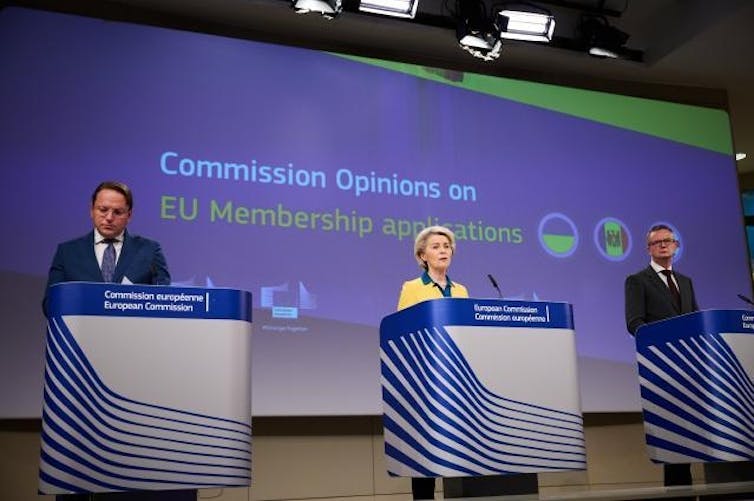 President of the European Commission Ursula von der Leyen and European Commissioner Olivér Várhelyi speaking at podiums.