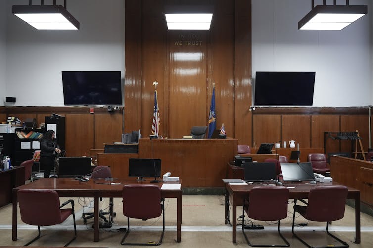 A wood-paneled courtroom.