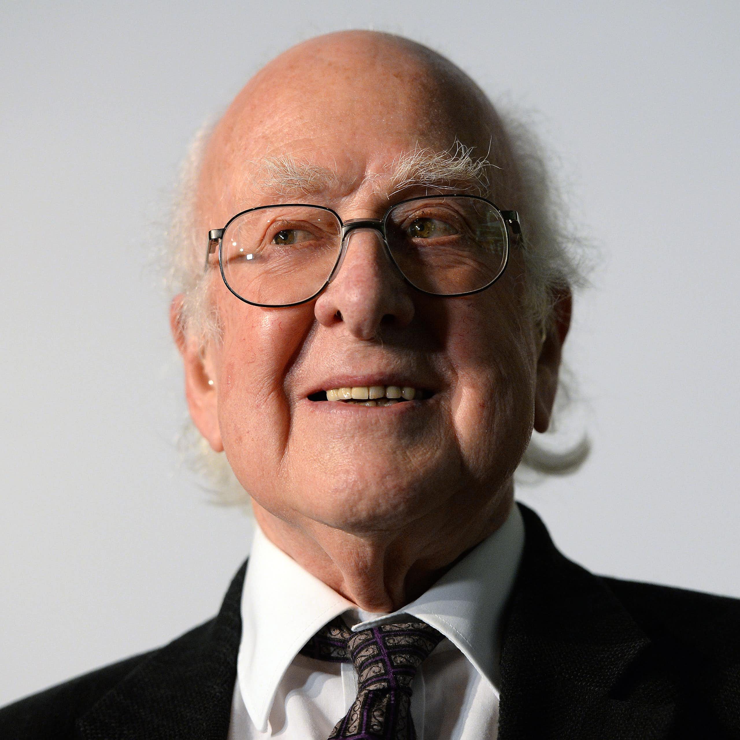 Head and shoulders portrait of grey-haired scientist, Peter Higgs