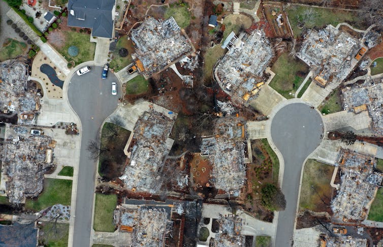 Driveways surrounded by burned-over lots