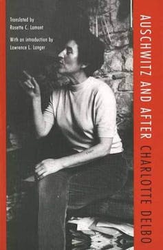 Woman points on front cover of a book,