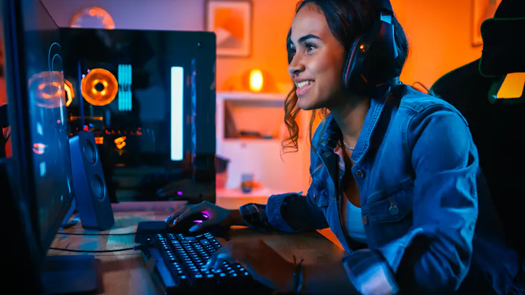 Woman gaming at computer.