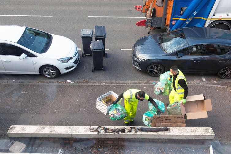 Our analysis presentations COVID-19 made other people admire side road cleaners extra – but it surely additionally made their lives tougher 2 Two refuse workers on a street.