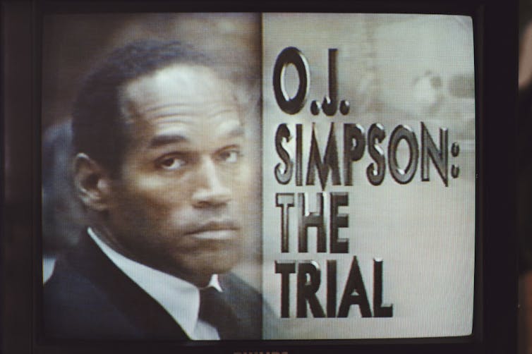 Television screen featuring a Black man's face accompanied by text reading 'O.J. Simpson: The Trial.'
