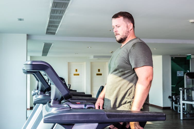 A man walks on a treadmill.
