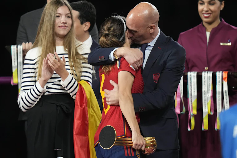 President of Spain's soccer federation, Luis Rubiales, embraces Spain's Aitana Bonmati
