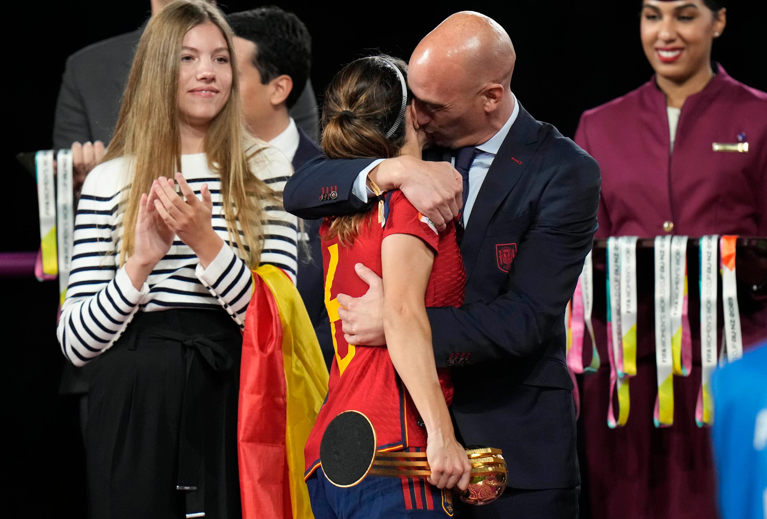 President of Spain's soccer federation, Luis Rubiales, embraces Spain's Aitana Bonmati