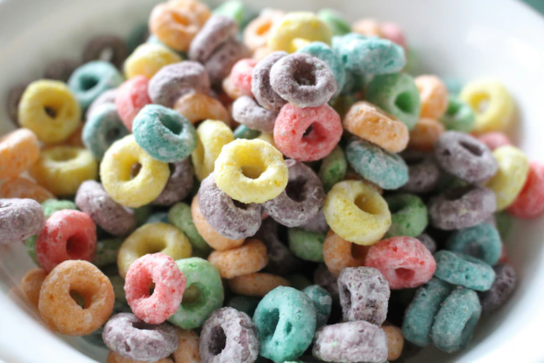 A bowl of Froot Loops breakfast cereal.