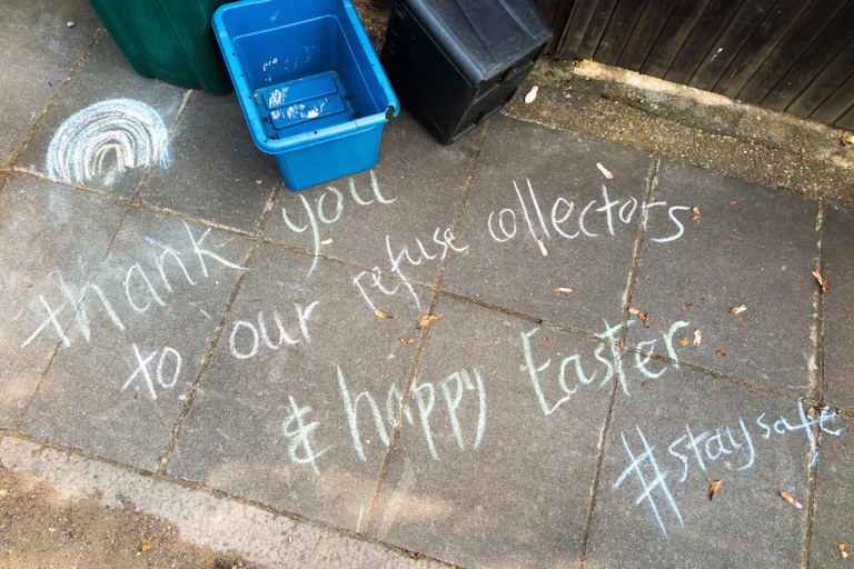 A message in chalk on a pavement.