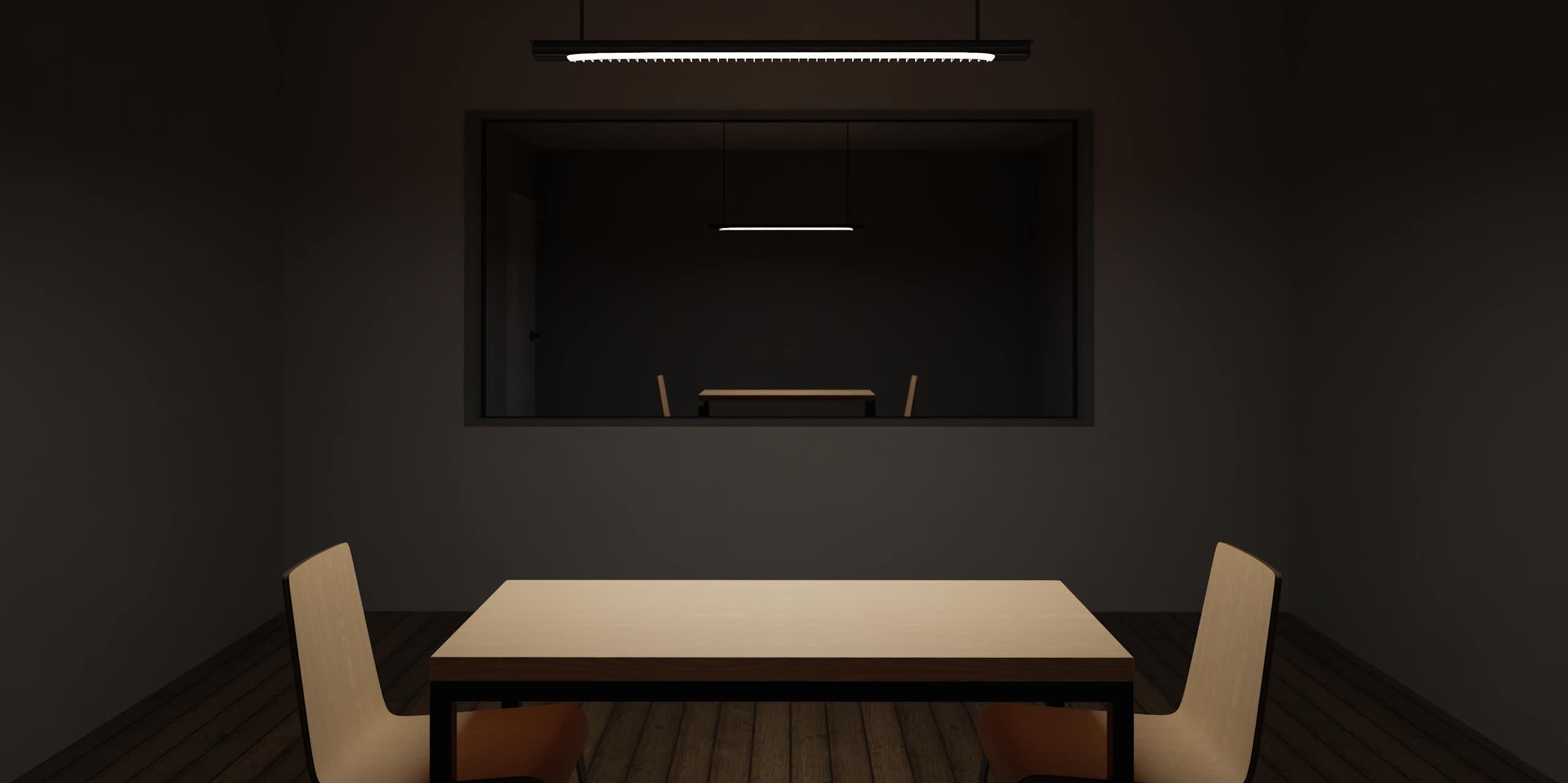 two chairs at a table with observation window into interrogation room