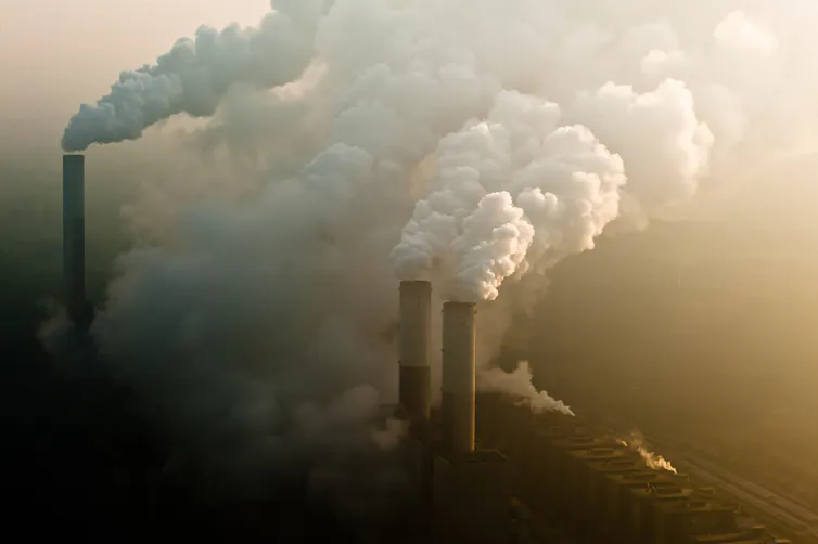 steam billows from chimneys