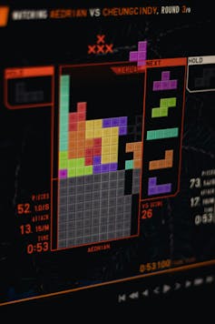 A close-up of a computer screen displaying an advanced level of tetris.