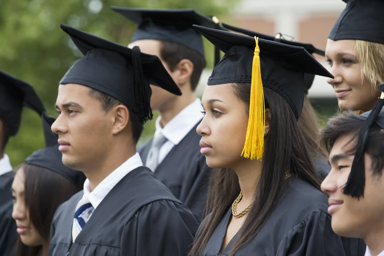 Low Graduation Graduation rates for low-income students lag while their student loan ...