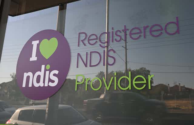 Window with printed lettering that reads: Registered NDIS provider