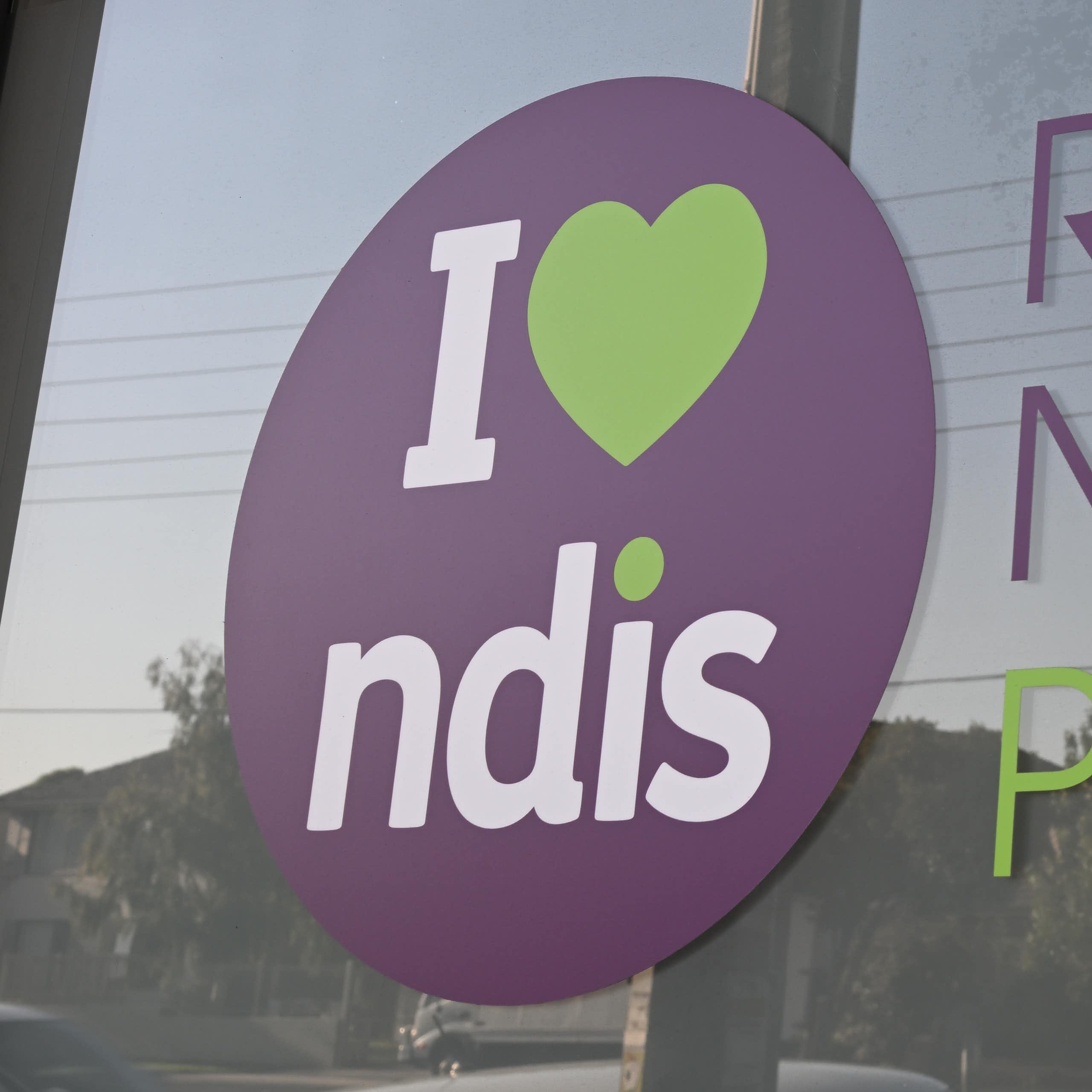 Window with printed lettering that reads: Registered NDIS provider
